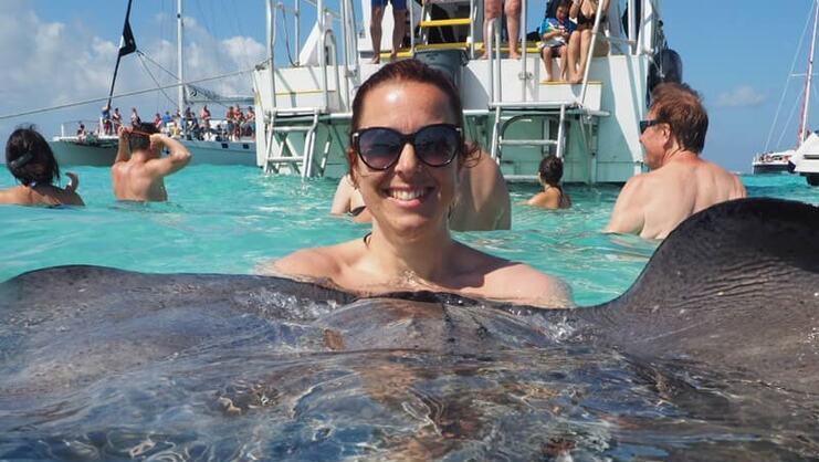 image of women holding a stingray