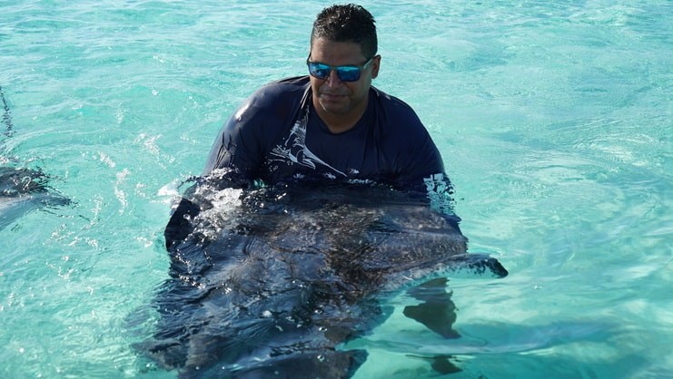 man holding stingray