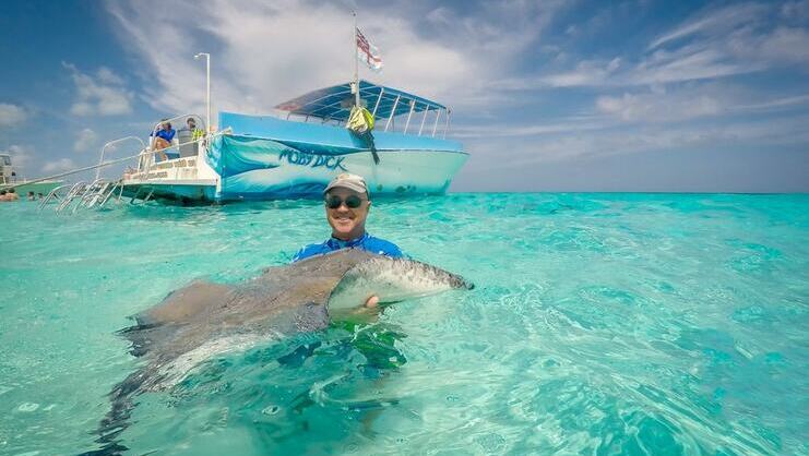 Picture of man holding a stingray