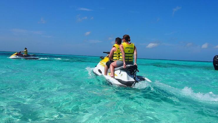 two people on a jet ski at Stingray City