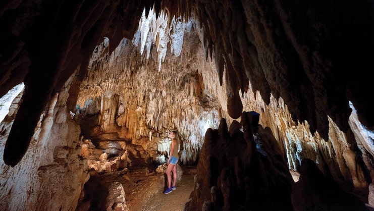 picture of women standing inside cave