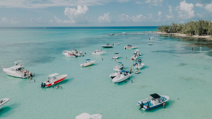 aerial image showing 15 boats and people at rum point