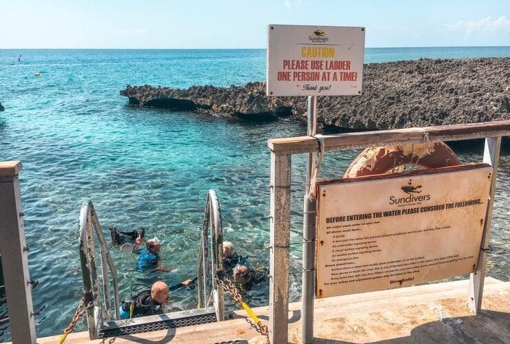 picture of people in water next to ladder