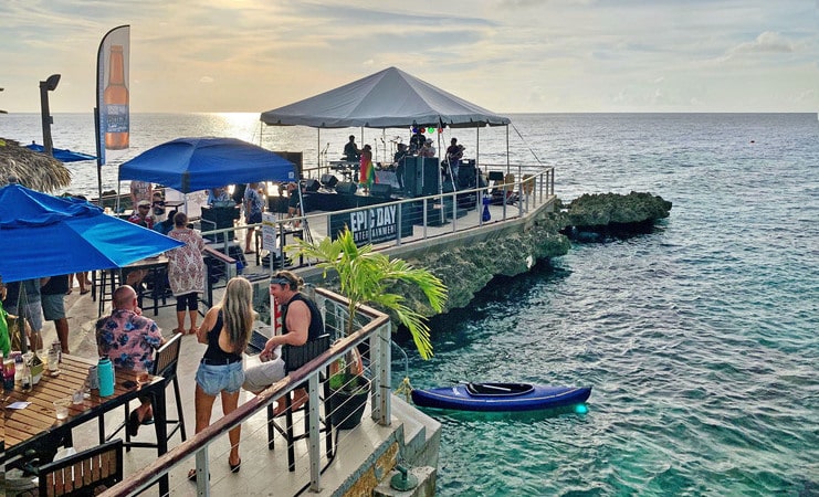 picture of lots of people at macabuca with sunset